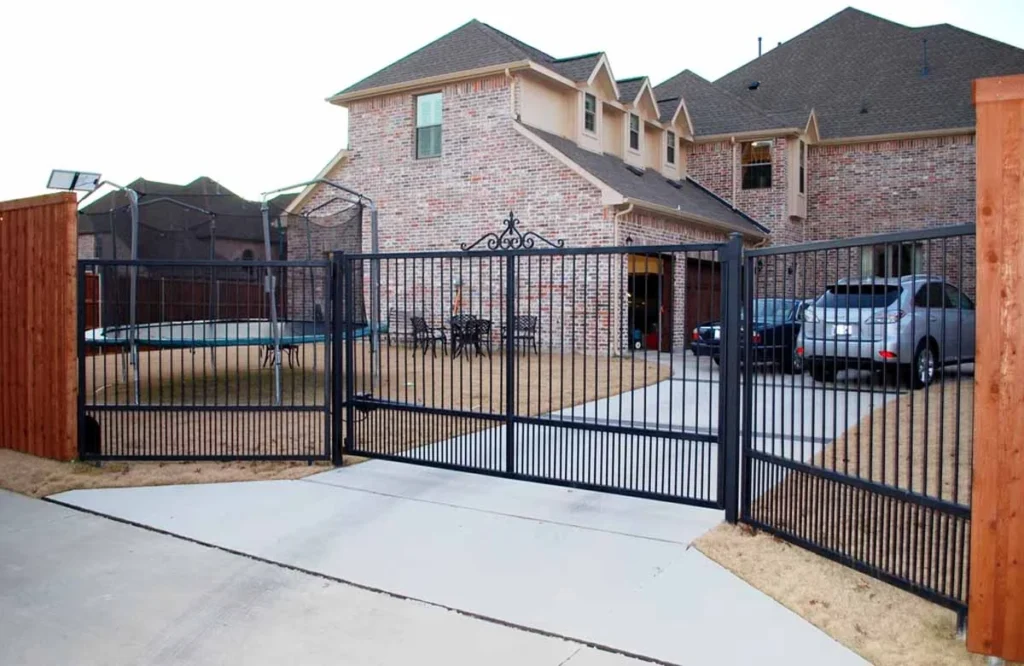 Designed for both aesthetics and protection, this electric gate secures a suburban Houston home.